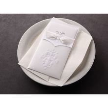 The traditional white embossed damask pocket invitation with its matching envelope